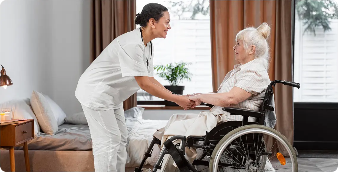 Caregiver supporting woman in wheelchair